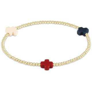 gold bead bracelet with red, white and blue crosses