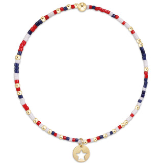 RED WHITE AND BLUE BEAD BRACELET WITH SMALL GOLD STAR CHARM