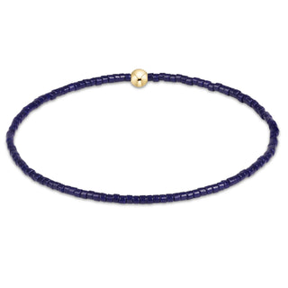 NAVY SEAD BEAD BRACELET WITH ONE GOLD BEAD