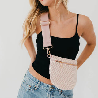 blush and cream leather bag in a woven pattern with gold zipper and blush strap